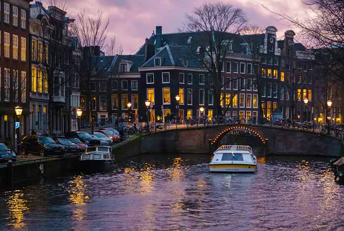 Canal Tour through illuminated Amsterdam
